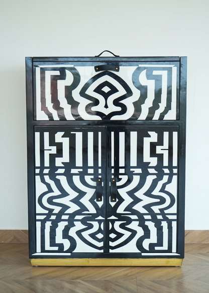Honeycomb bar cabinet black and white geometric pattern with brass base and leather top handle