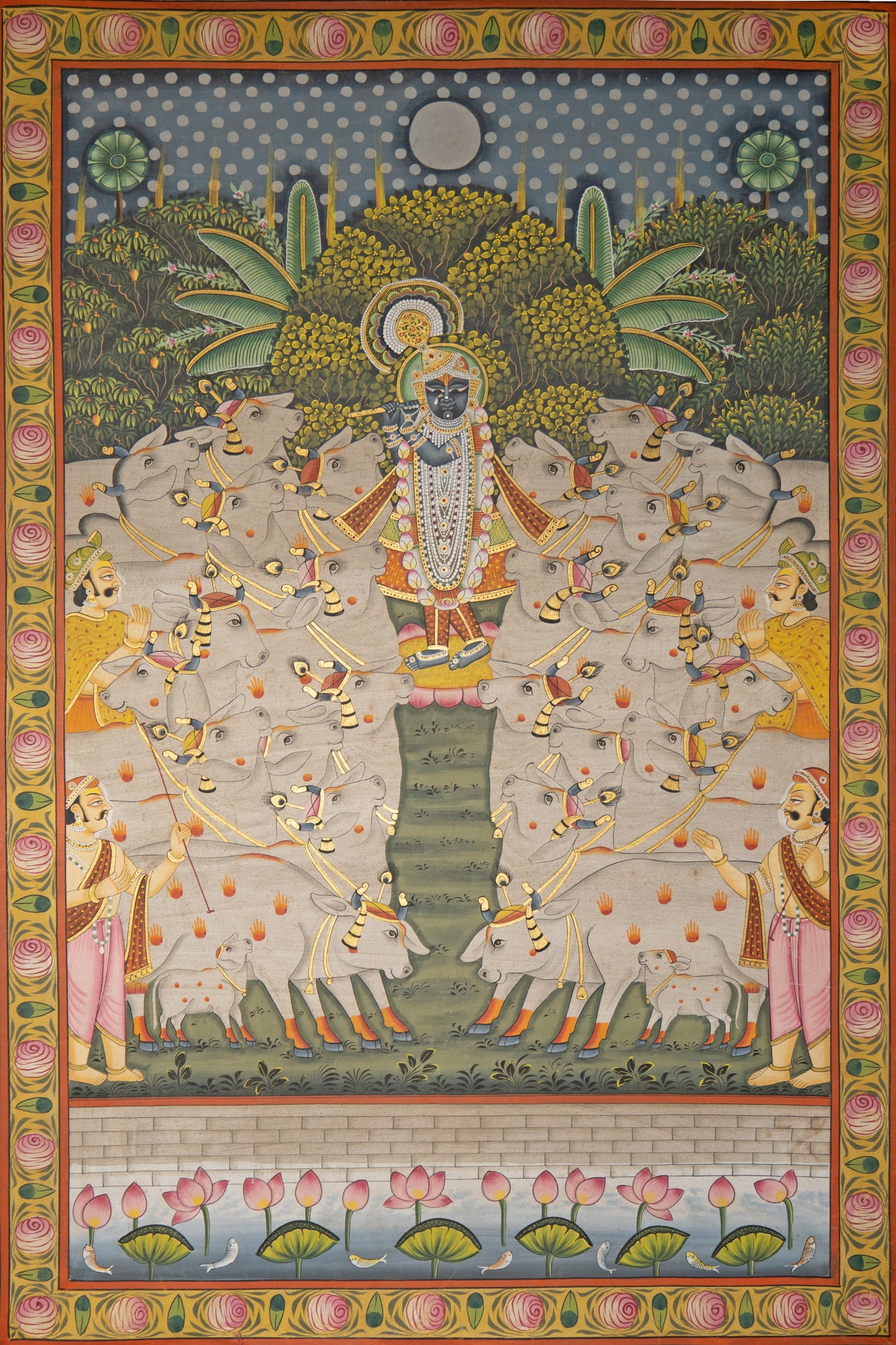 Festival of cattle with gold leaf detailing Pichwai Painting. Depicting Krishna surrounded by white cows and lotus border