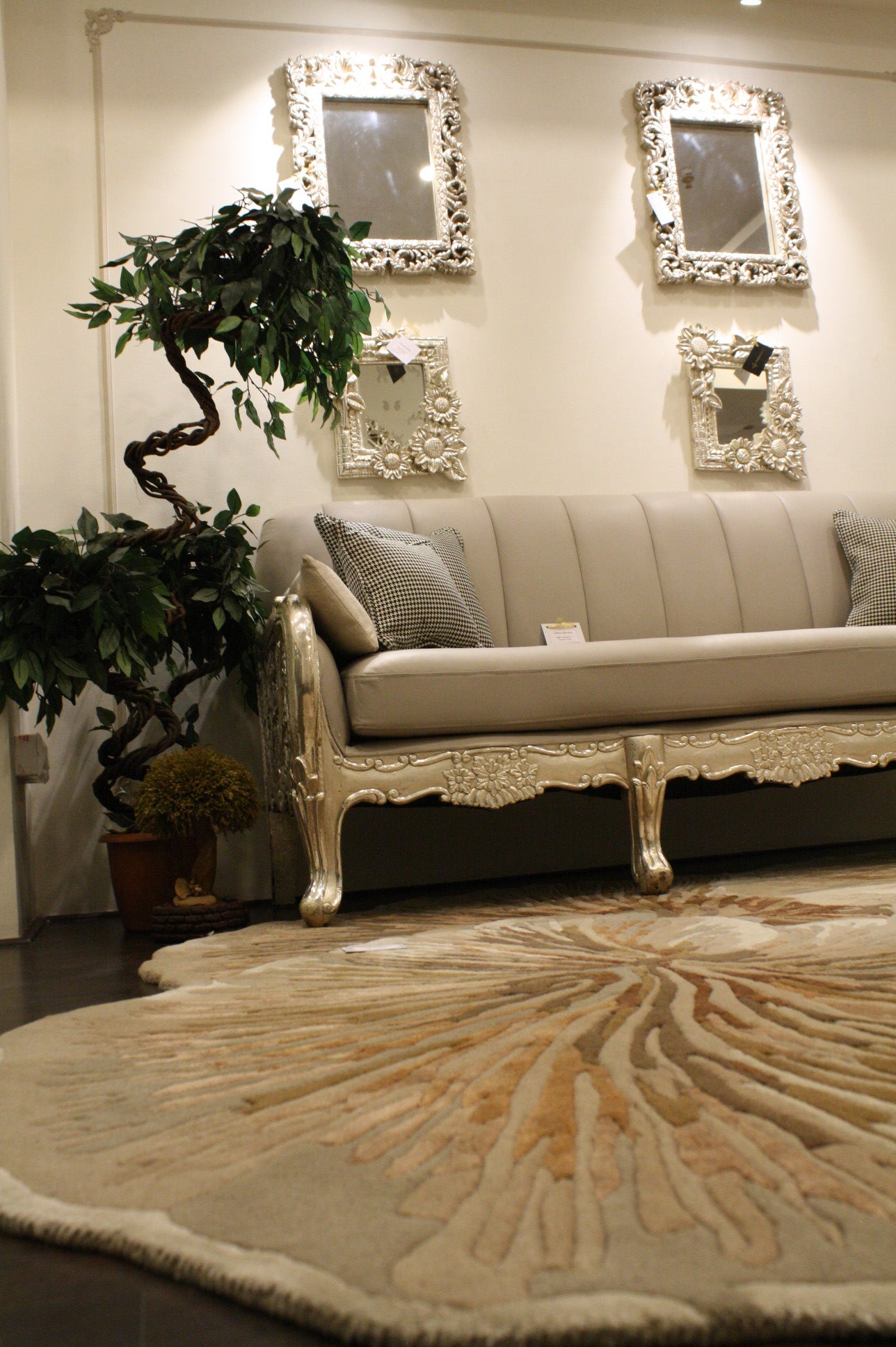 Mushroom Rug round beige and tan textured area rug in elegant living room with cream sofa and decorative mirrors