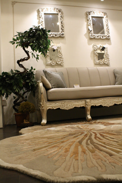 Mushroom Rug round beige and tan textured area rug in elegant living room with cream sofa and decorative mirrors